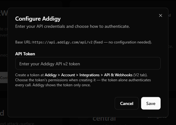 Addigy credential-field example showing the single API Token field and the fixed base URL note